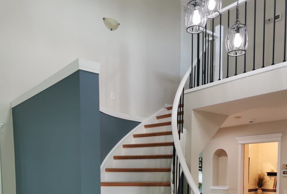 stained oak railing after being painted white  - railing painting calgary