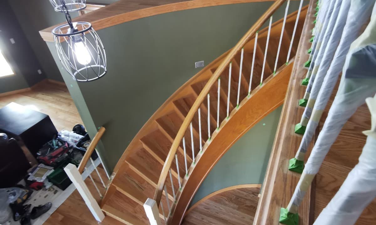 stained oak railing prior to being painted white  - railing painting calgary